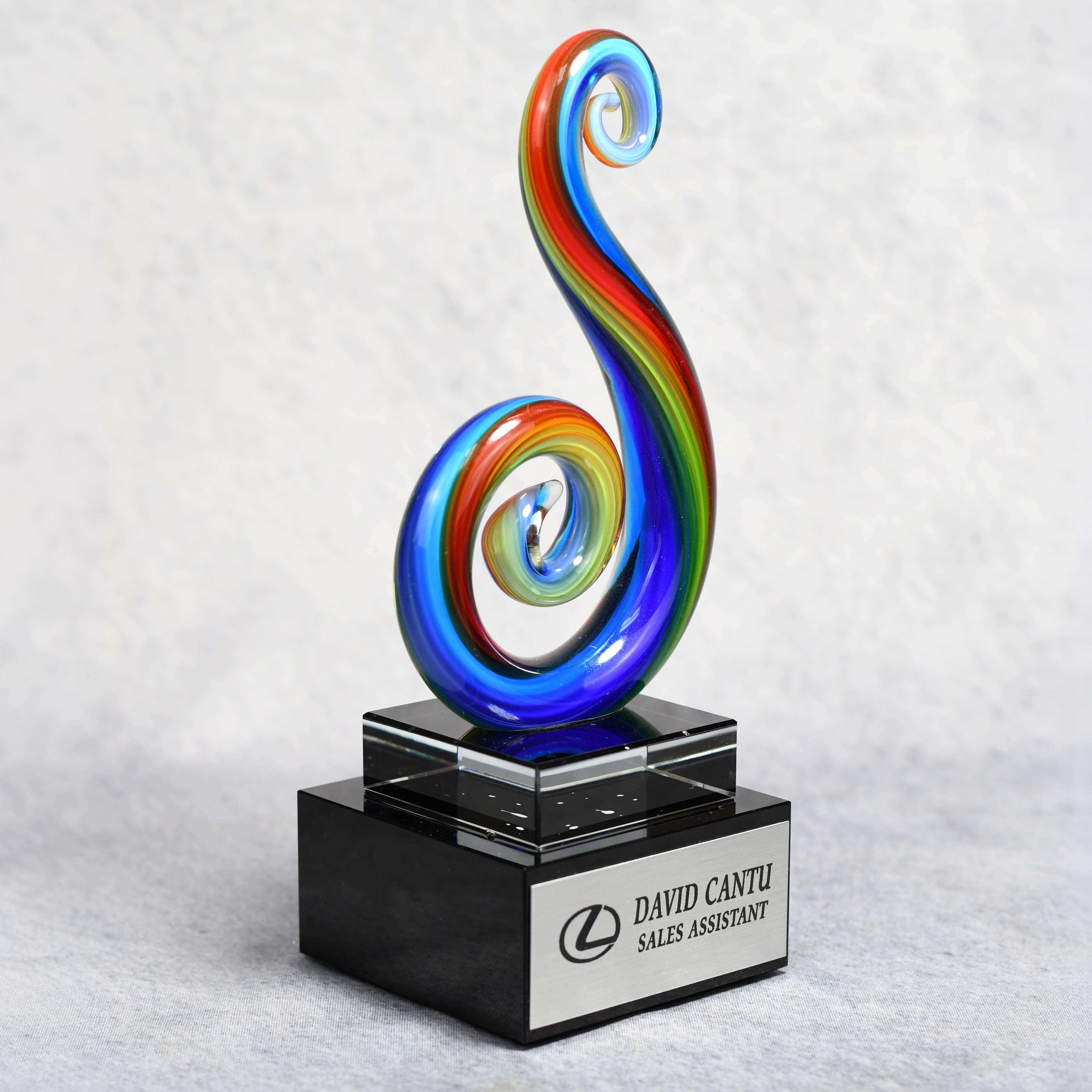 Art Glass Multi Color Curley Que on Clear Glass Base