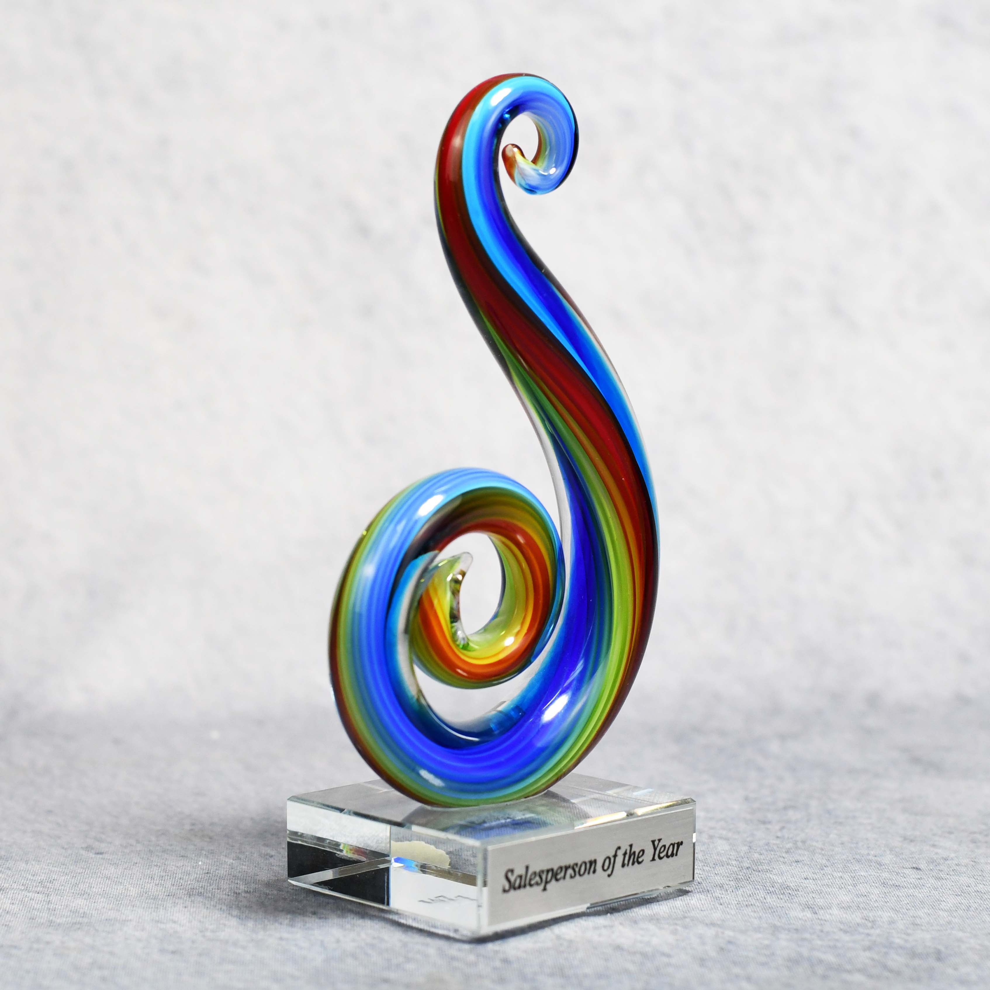 Art Glass Multi Color Curley Que on Clear Glass Base